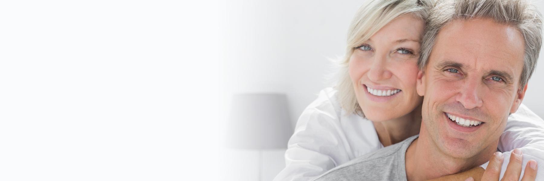 man and woman smiling | Perth's best dental implants